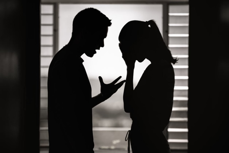 silhouette of couple arguing